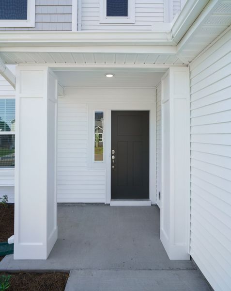 Representative exterior photo of a completed home built from the The Calle by Cothran Homes in Holly Ridge, Greenville, SC (Image 24). Representative exterior photo of a completed home built from the The Calle by Cothran Homes in Holly Ridge, Greenville, SC (Image 24).