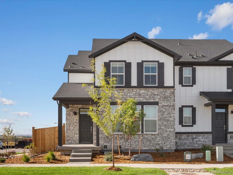 Front exterior of a new home in Horizon Uptown: The Mountain Collection, Aurora, CO, highlighting curb appeal (Image 2). Front exterior of a new home in Horizon Uptown: The Mountain Collection, Aurora, CO, highlighting curb appeal (Image 2).