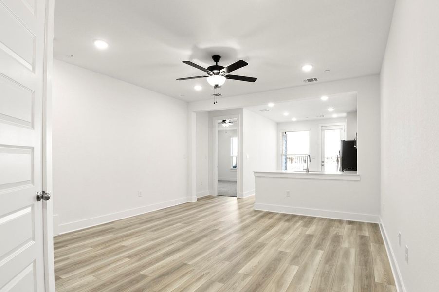 Unfurnished room featuring recessed lighting, light wood finished floors, and ceiling fan