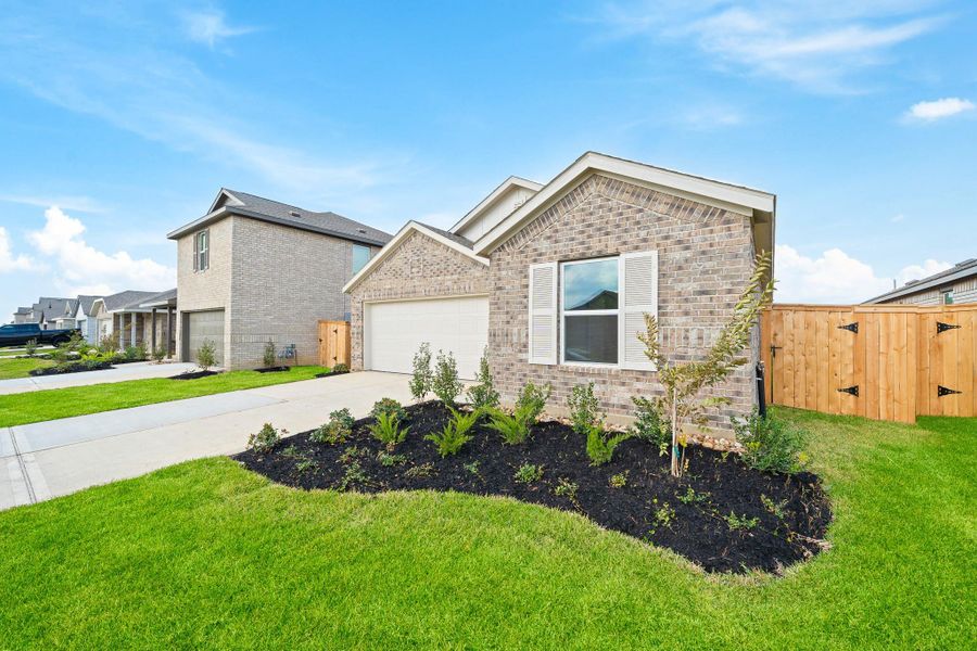 Front exterior of a new home in The Grand Prairie, Hockley, TX, highlighting curb appeal (Image 2). Front exterior of a new home in The Grand Prairie, Hockley, TX, highlighting curb appeal (Image 2).