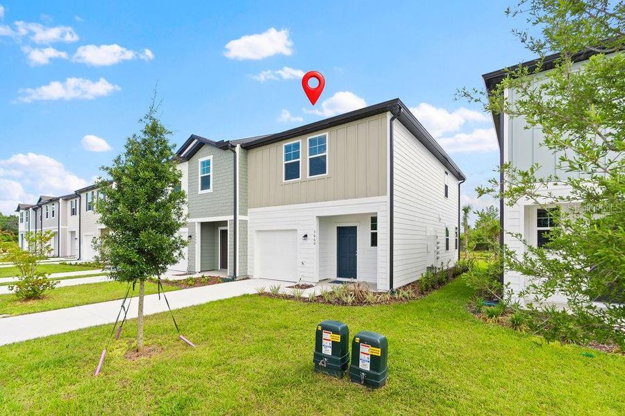 Front exterior of a new home in , Davenport, FL, highlighting curb appeal (Image 15).