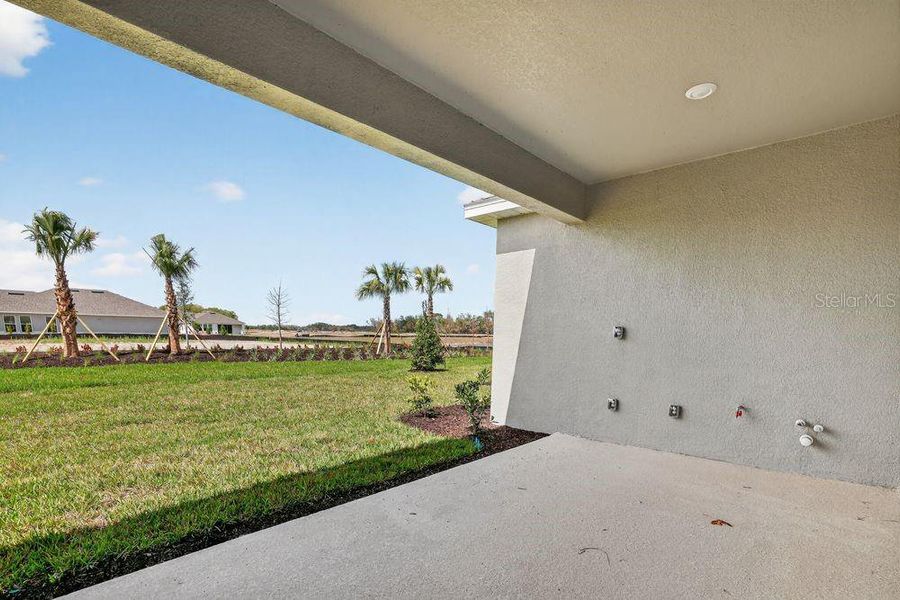 Exterior details and patio area of a home in Firethorn, Parrish (Image 29).
