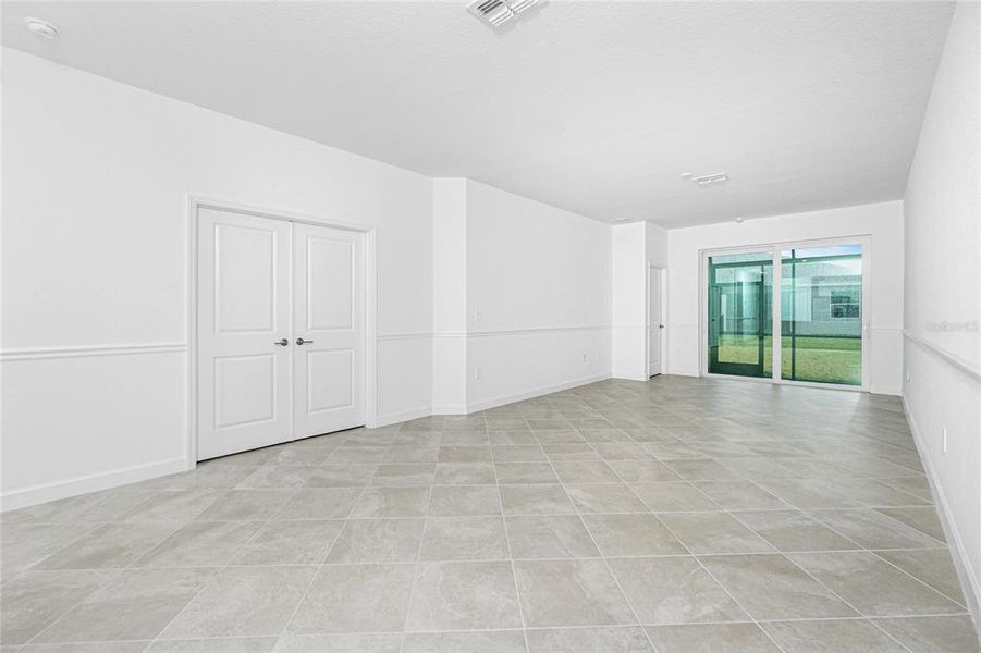 Spacious, unfurnished interior of a new home in Island Lakes at Coco Bay: Villas, Englewood (Image 24).