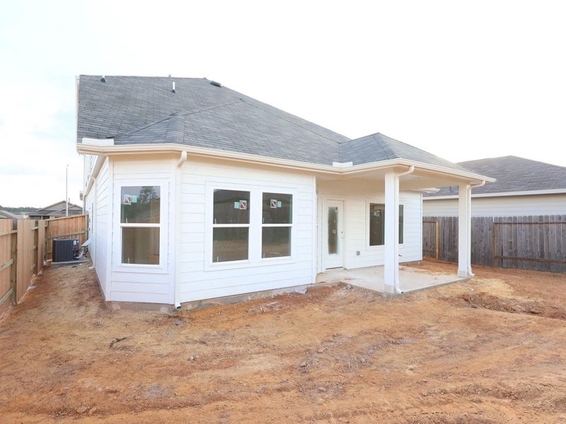 Exterior details and patio area of a home in Magnolia Ridge, Magnolia (Image 3).