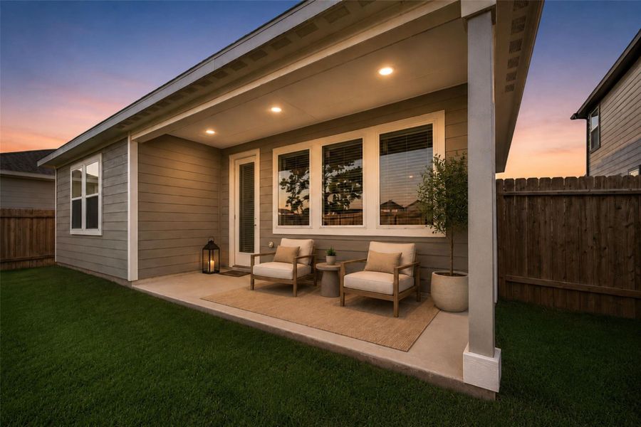 Fully fenced backyard with covered patio and open green space, offering room for outdoor seating, play, or future customization.Virtually staged furnishings shown for visual purposes only.