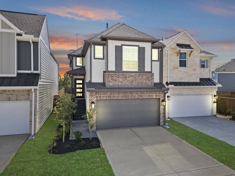 Front exterior of a new home in Bridgeland, Cypress, TX, highlighting curb appeal (Image 21). Front exterior of a new home in Bridgeland, Cypress, TX, highlighting curb appeal (Image 21).