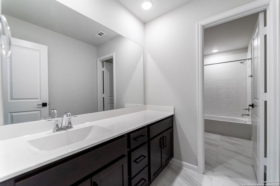 Furnished interior view inside a new home in The Woodlands at Medina Hills, Mico (Image 3).