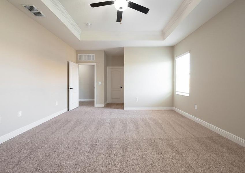 The master bedroom has its own walk-in closet and bathroom.