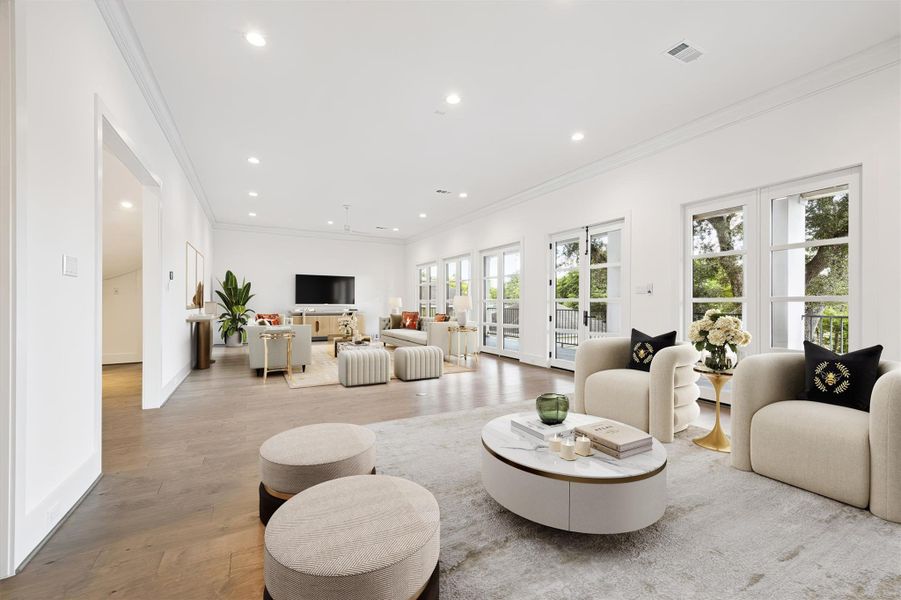 The family room provides enough space for two separate seating areas - a cozy family area plus a more formal seating space conveniently located by the kitchen where guest and family alike always naturally gravitate. French doors open to the covered patio overlooking the backyard and provide easy flow when entertaining indoors and out.*Virtually staged. The family room provides enough space for two separate seating areas - a cozy family area plus a more formal seating space conveniently located by the kitchen where guest and family alike always naturally gravitate. French doors open to the covered patio overlooking the backyard and provide easy flow when entertaining indoors and out.*Virtually staged.