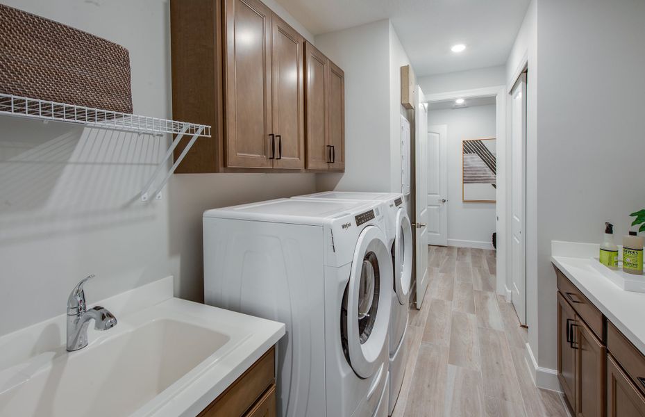 Spacious laundry room with optional sink and additional cabinets - perfect for storage Spacious laundry room with optional sink and additional cabinets - perfect for storage