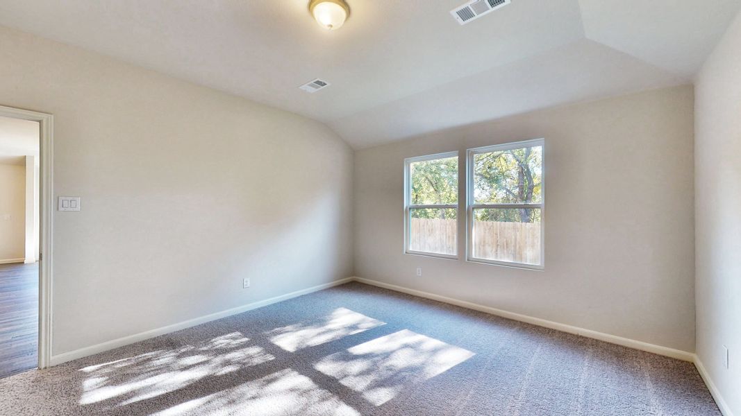 A room with a rug and windows. A room with a rug and windows.