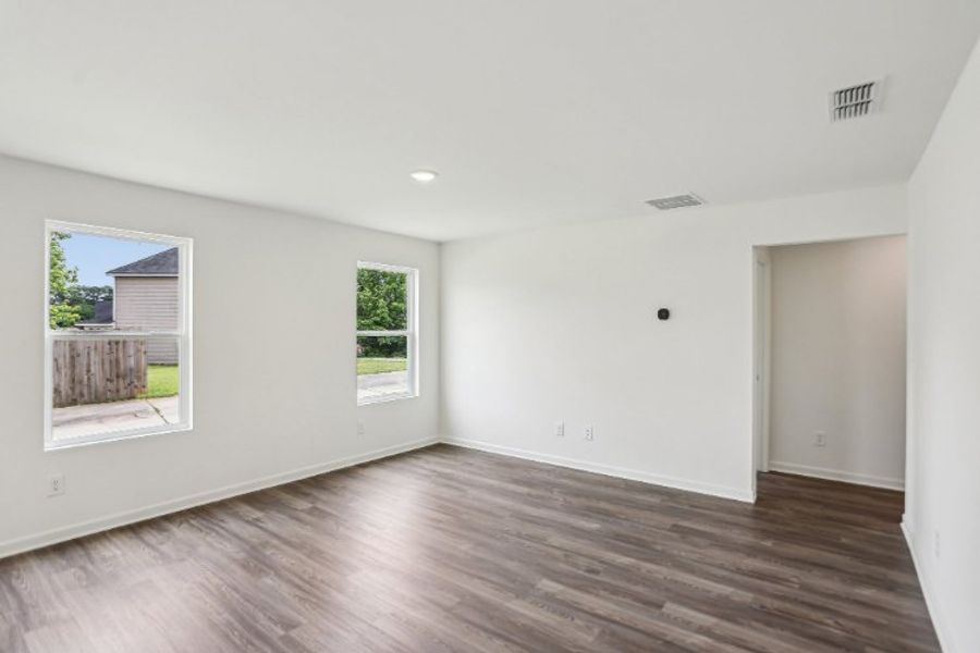 A room with a wood floor and a wood floor. A room with a wood floor and a wood floor.