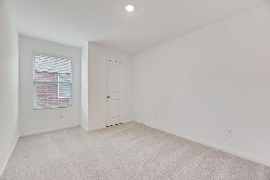 Unfurnished room featuring carpet floors and baseboards