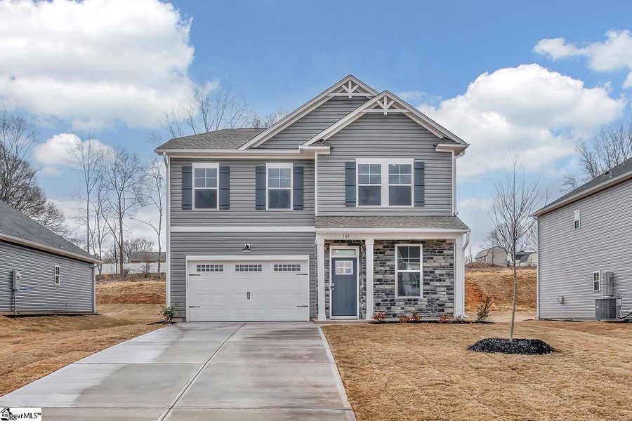 Front exterior of a new home in Lynbrook, Boiling Springs, SC, highlighting curb appeal (Image 1). Front exterior of a new home in Lynbrook, Boiling Springs, SC, highlighting curb appeal (Image 1).