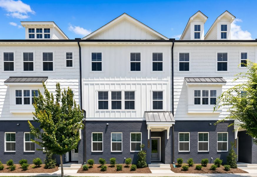 Front exterior of a new home in Borough 33 Townhomes, Chattanooga, TN, highlighting curb appeal (Image 1). Front exterior of a new home in Borough 33 Townhomes, Chattanooga, TN, highlighting curb appeal (Image 1).