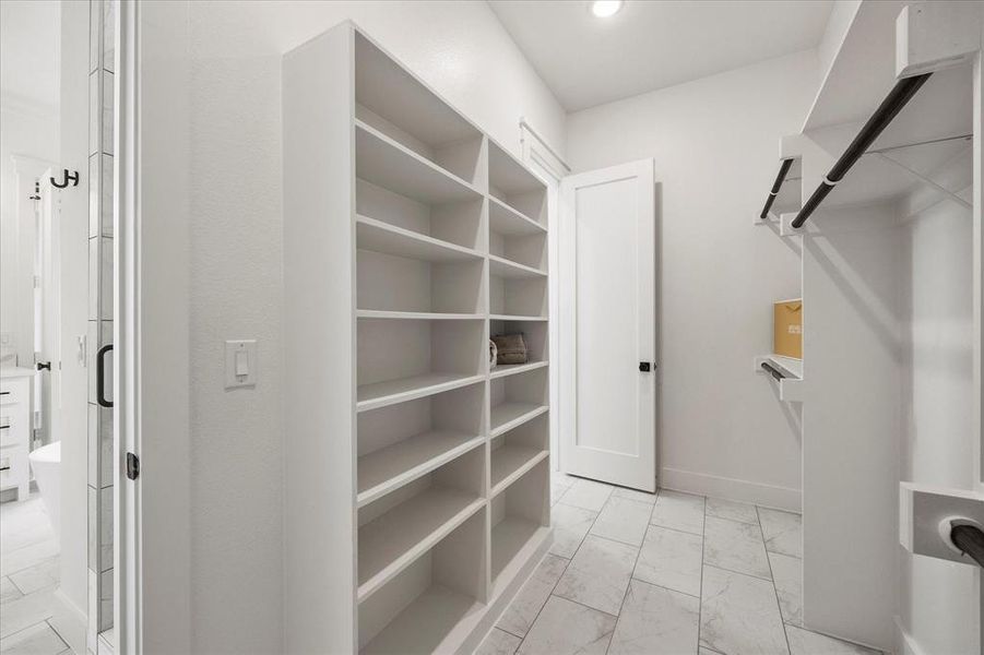 Spacious closet featuring light tile patterned floors