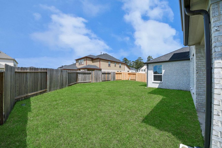 Discover the expansive backyard and its inviting covered patio – a perfect haven for both playtime for the kids and relaxation for adults. This outdoor space is an ideal canvas for your outdoor living dreams, complete with room for patio furniture, a BBQ pit, and endless possibilities for creating your own personalized oasis.