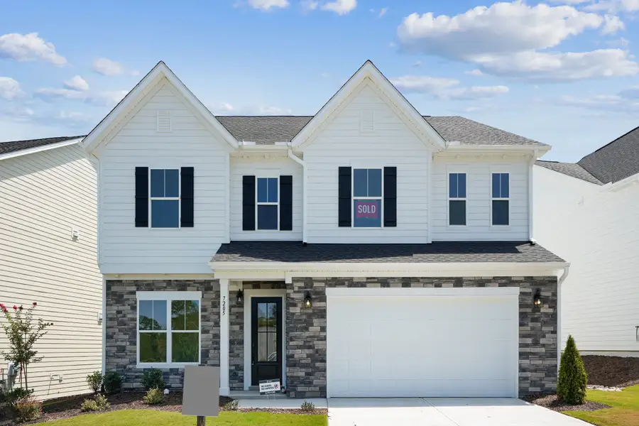 Representative exterior photo of a completed home built from the Lure by Caruso Homes in Blue Run, Raleigh, NC (Image 23). Representative exterior photo of a completed home built from the Lure by Caruso Homes in Blue Run, Raleigh, NC (Image 23).