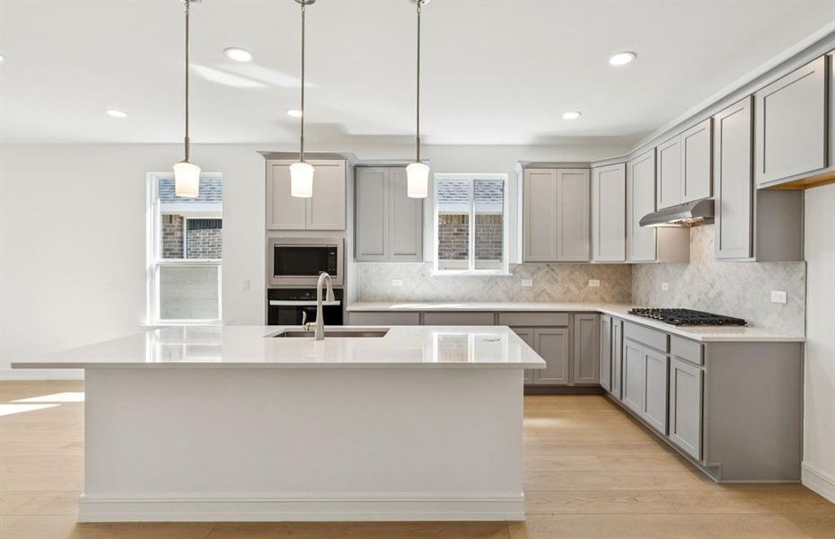 Bright kitchen with an expansive center island perfect for gatherings
