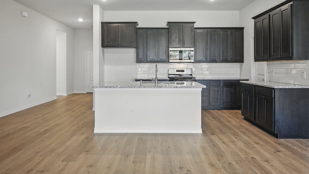 Representative furnished interior of a home built from the Harbour by D.R. Horton in The Woods at Lindsey Place, Anna (Image 4).