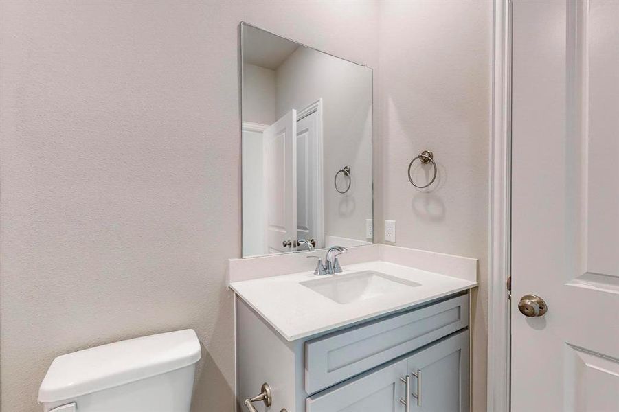 Bathroom with vanity and toilet