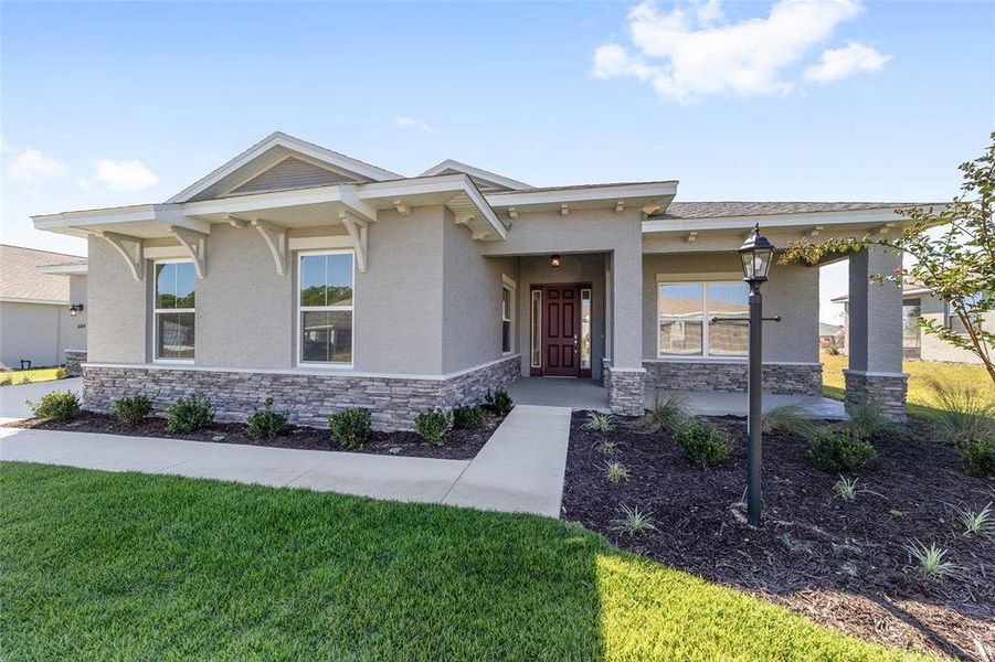 Exterior details and patio area of a home in On Top of the World Communities, Ocala (Image 27).