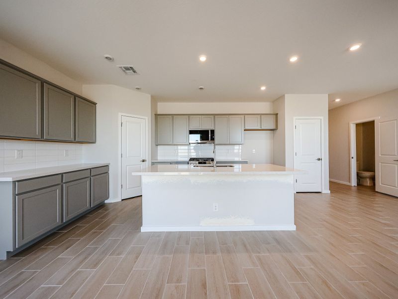 A kitchen with white cabinets. A kitchen with white cabinets.