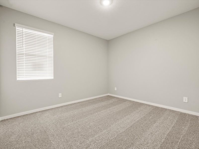 Spacious, unfurnished interior of a new home in Blossom Rock Reserve Series, Apache Junction (Image 13).