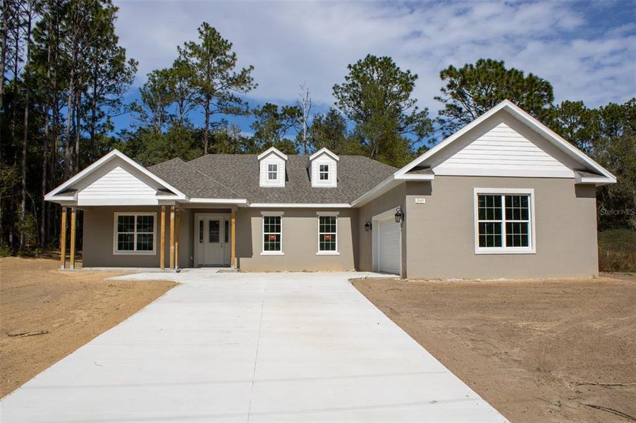 Front exterior of a new home in Pine Ridge Estates, Beverly Hills, FL, highlighting curb appeal (Image 1). Front exterior of a new home in Pine Ridge Estates, Beverly Hills, FL, highlighting curb appeal (Image 1).