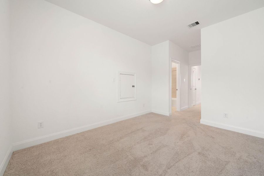The fourth bedroom is tucked away at the end of the hall upstairs with it's own ensuite bathroom.