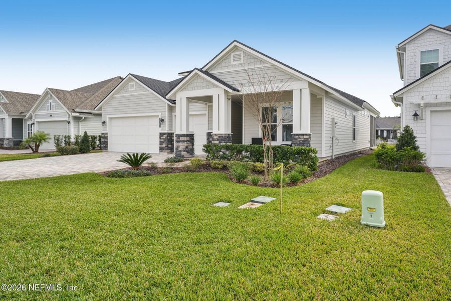 Front exterior of a new home in Middlebourne, St. Johns, FL, highlighting curb appeal (Image 29).