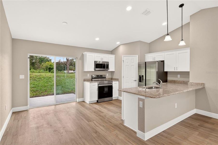 Furnished interior view inside a new home in , Dunnellon (Image 8).