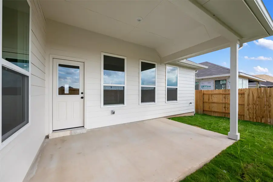 Exterior details and patio area of a home in The Colony, Bastrop (Image 3).