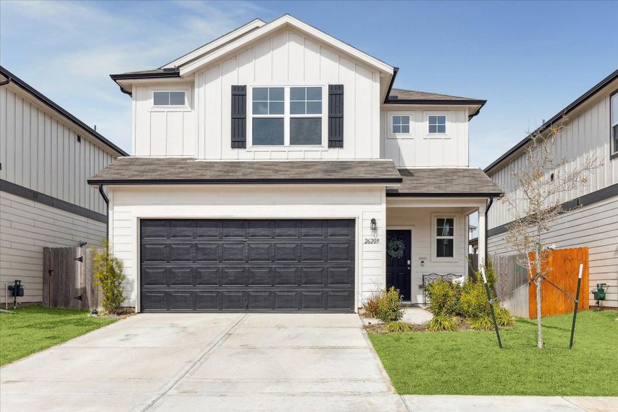Front exterior of a new home in Decker Farms, Magnolia, TX, highlighting curb appeal (Image 1). Front exterior of a new home in Decker Farms, Magnolia, TX, highlighting curb appeal (Image 1).