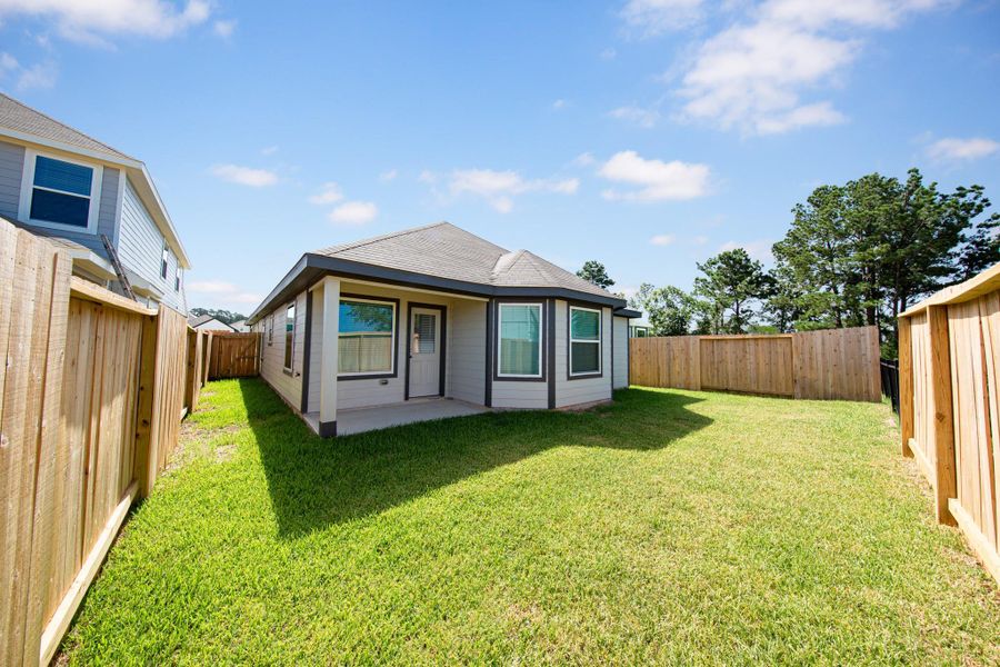 Front exterior of a new home in Ridgeland Hills, Willis, TX, highlighting curb appeal (Image 12).