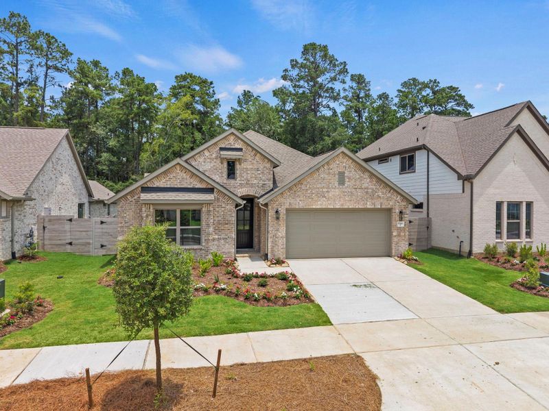 Front exterior of a new home in Two Step Farm, Montgomery, TX, highlighting curb appeal (Image 2). Front exterior of a new home in Two Step Farm, Montgomery, TX, highlighting curb appeal (Image 2).