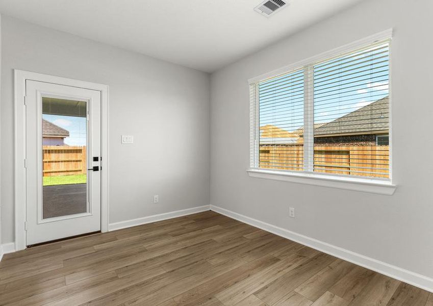 A door in the dining rooms leads to the covered back patio