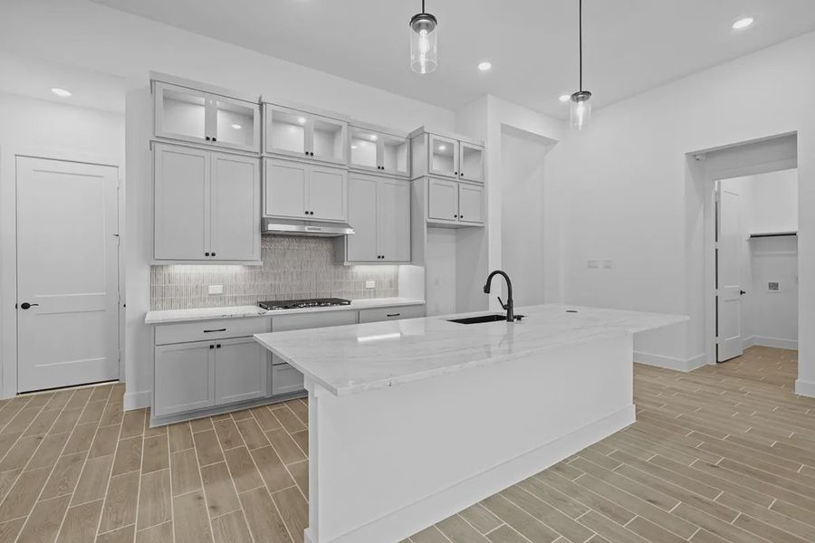 Representative furnished interior of a home built from the Summerton by Chesmar Homes in University Heights, Round Rock (Image 8).