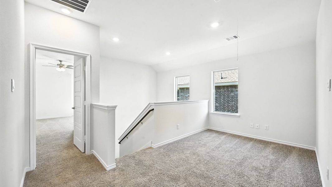 Representative unfurnished interior of a home built from the Aquamarine by D.R. Horton in The Woods at Lindsey Place, Anna (Image 10).