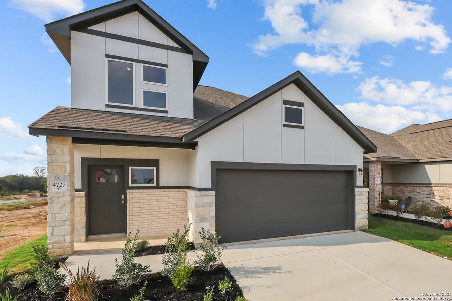 Front exterior of a new home in Garden Grove, Schertz, TX, highlighting curb appeal (Image 20).