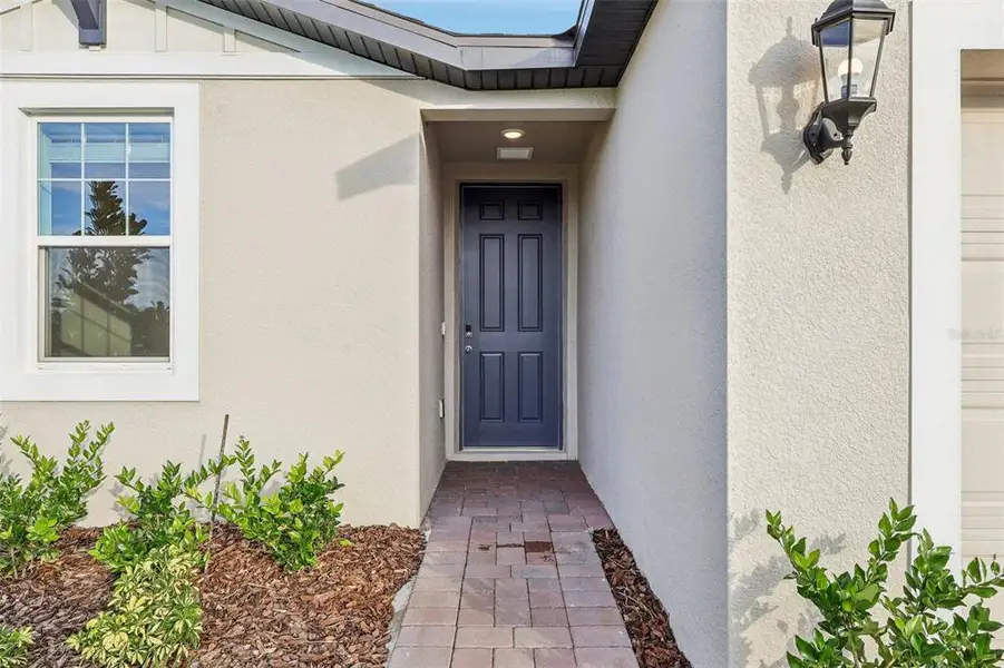 Exterior details and patio area of a home in The Reserve at Twin Lakes, St. Cloud (Image 4).