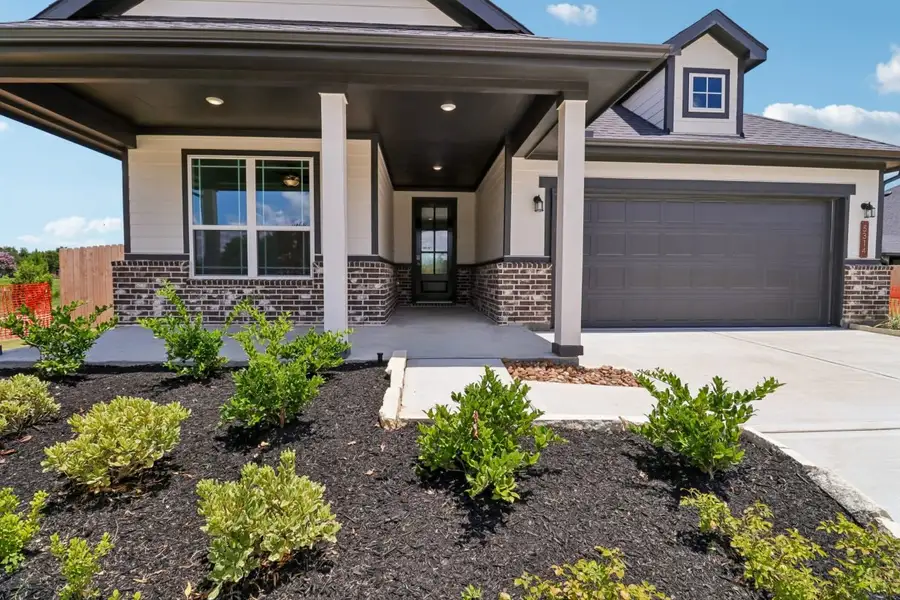 Exterior details and patio area of a home in Trinity Grove, Spring (Image 3).