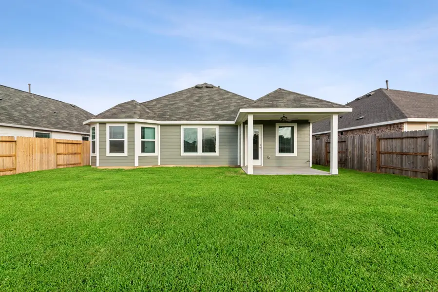 Exterior details and patio area of a home in Pinewood at Grand Texas, New Caney (Image 10).