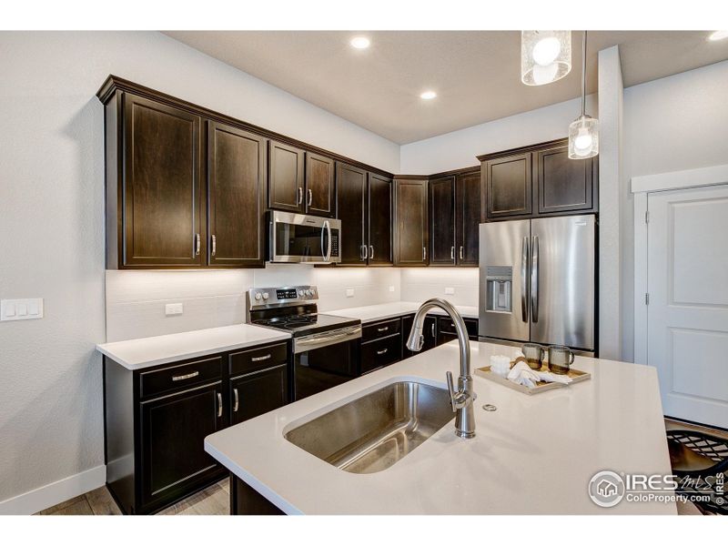 Furnished interior view inside a new home in The Lakes at Centerra - The Shores, Loveland (Image 10).