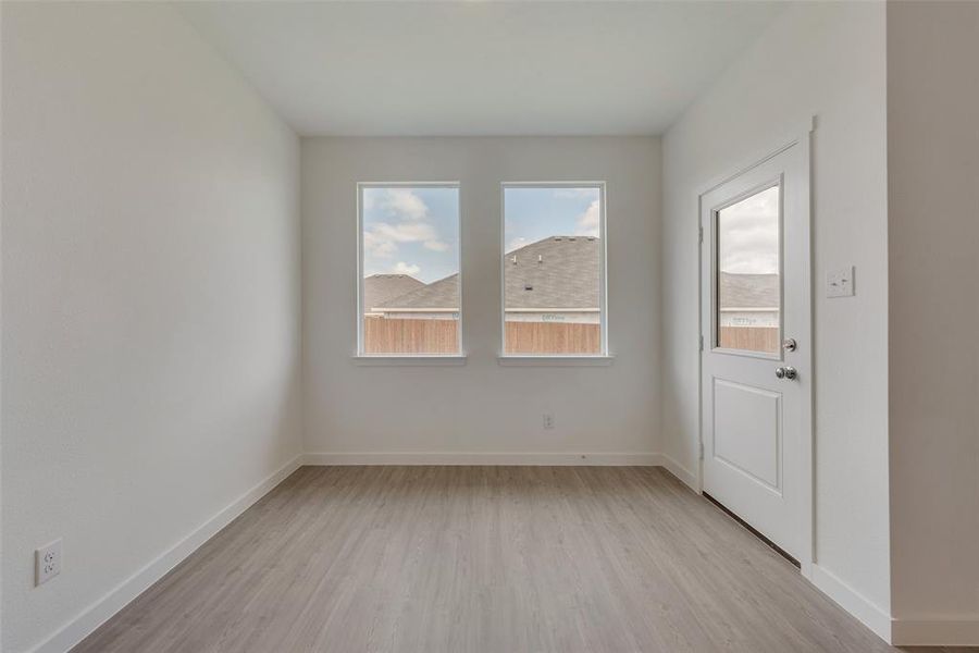 Spare room with light wood-type flooring