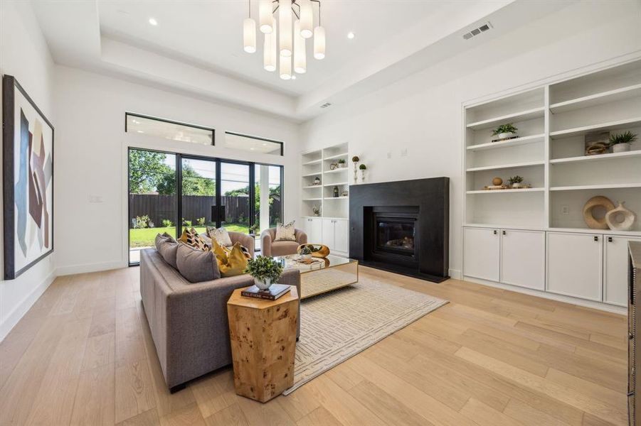 Spacious living room with sliding doors to the private backyard and patio. Spacious living room with sliding doors to the private backyard and patio.