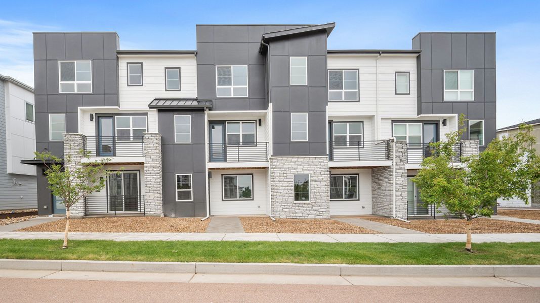 Front exterior of a new home in The Commons at Victory Ridge, Colorado Springs, CO, highlighting curb appeal (Image 2). Front exterior of a new home in The Commons at Victory Ridge, Colorado Springs, CO, highlighting curb appeal (Image 2).