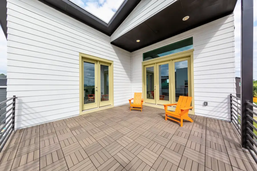 Exterior details and patio area of a home in The Brownstones at East Quarter, Dallas (Image 21).