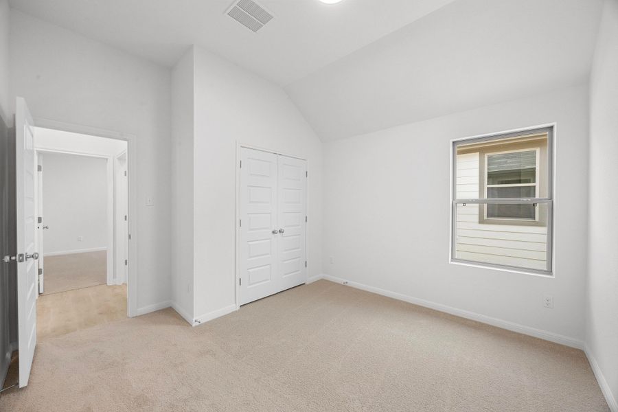 Bedroom in the Cypress home plan by Trophy Signature Homes - REPRESENTATIVE PHOTO