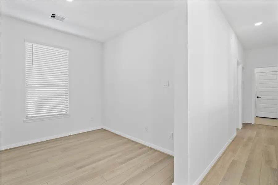 The Den is pictured here the generous hallway leading to the secondary bedrooms, secondary bathroom, and laundry room. The Den is pictured here the generous hallway leading to the secondary bedrooms, secondary bathroom, and laundry room.